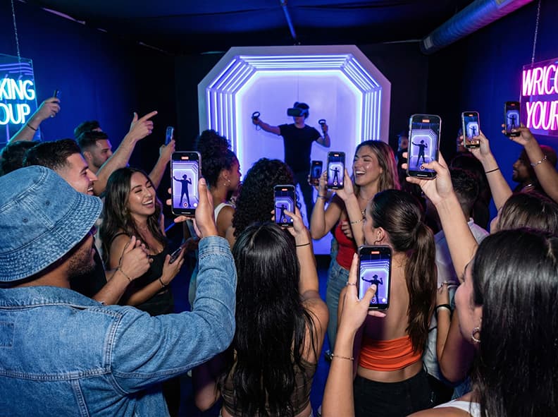 Crowd filming a VR activation